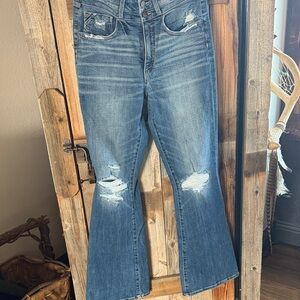 Women's Buckle Black Distressed Blue Jeans